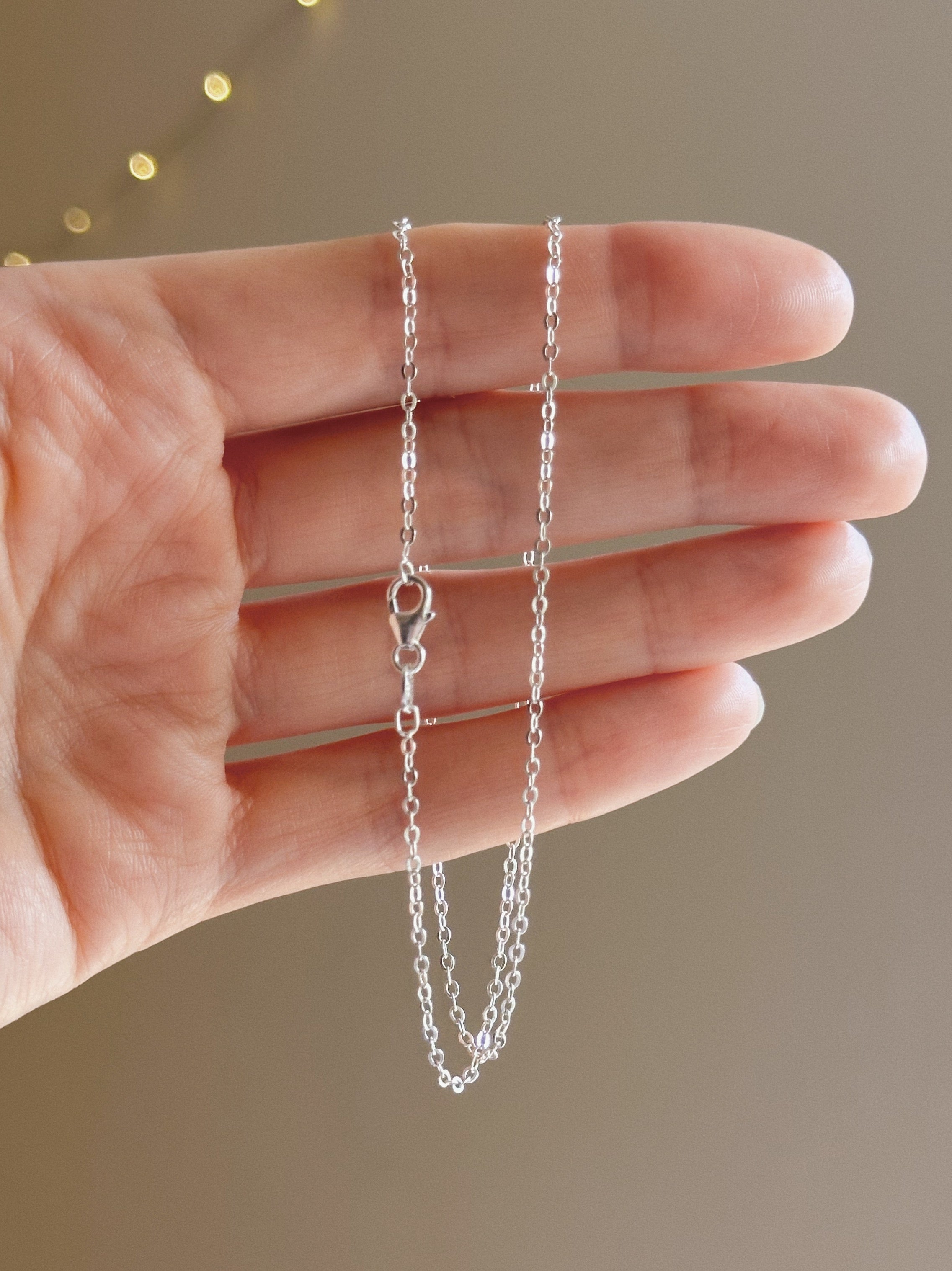 Flat cable charm keeper chain